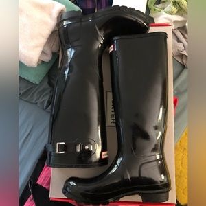 Hunter tall boots.